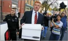  ?? GENE J. PUSKAR — THE ASSOCIATED PRESS ?? Former Penn State University assistant football coach Mike McQueary, center, leaves the Centre County Courthouse Annex in Bellefonte, Pa., Monday. The trial for McQueary’s defamation and whistleblo­wer lawsuit against Penn State over how it treated him...