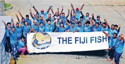  ?? Picture: JONA KONATACI ?? Staff members of Fiji Fish Marketing Group celebrated Fiji Day at their Lami office yesterday.