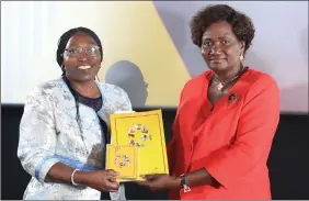  ?? Photo: Emmency Nuukala ?? Promote TVET… Itah Kandjii-Murangi, minister of higher education, (right) hands over textbooks and DVD copies of all the Live Your Passion candidates’ stories to deputy education minister Faustina Caley.