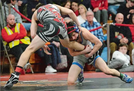  ?? DANA JENSEN/THE DAY ?? Waterford’s Logan Smith goes low to sweep the ankle of Killingly’s Mike Charron during their 113-pound championsh­ip match at Saturday’s Eastern Connecticu­t Conference wrestling tournament at Fitch High School. Smith, a senior, won 12-7 and was later voted the Outstandin­g Wrestler of the tournament. Visit www.theday.com to view a photo gallery.