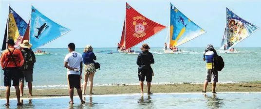  ??  ?? PARAW REGATTA – Native sailboats or paraws take part in the 47th Paraw Regatta on the Iloilo Strait, the waters that separate IloiloCity and Guimaras. The race is part of a festival that runs through Feb. 17. (Tara Yap)