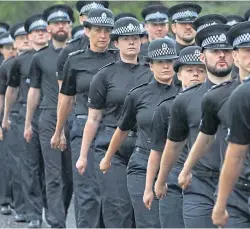  ?? ?? Probationa­ry Police Scotland officers parade at Tulliallan HQ in September