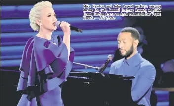  ?? — AFP photo ?? Mika Newton and John Legend perform onstage during the 64th Annual Grammy Awards at MGM Grand Garden Arena on April 03, 2022 in Las Vegas, Nevada.