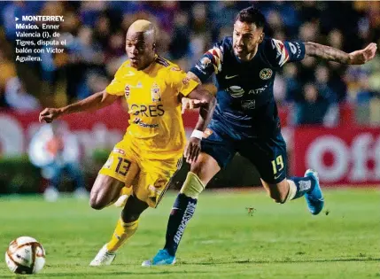  ?? AFP ?? ►M ONTERREY, México. Enner Valencia (i), de Tigres, disputa el balón con Víctor Aguilera.