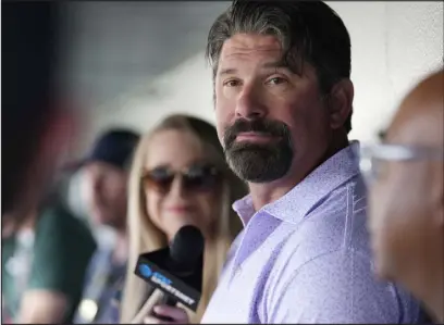  ?? DAVID ZALUBOWSKI — THE ASSOCIATED PRESS ?? Retired Rockies first baseman Todd Helton talks to reporters before a game on Aug. 19 at Coors Field.