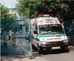  ??  ?? NEW DELHI: An ambulance, present as a precaution­ary measure, leaves a cargo area near the internatio­nal terminal at New Delhi’s internatio­nal airport yesterday. — AFP