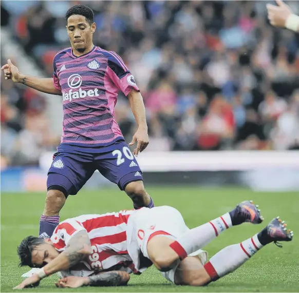  ??  ?? Sunderland midfielder Steven Pienaar leaves Stoke City utility man Geoff Cameron on the ground at the Bet365 Stadium last weekend