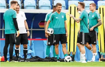  ??  ?? (From left, Germany’s goalkeeper Marc-Andre Ter Stegen, coaching assistant Miroslav Klose, Germany’s forward Thomas Mueller, Germany’s forward Marco Reus and Germany’s midfielder Toni Kroos attend a training session at the Fisht Olympic Stadium in...