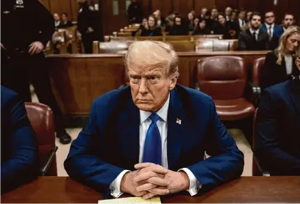  ?? Pool/Getty Images ?? Donald Trump attends his trial Monday in New York City. After leaving the courtroom, he lamented to reporters: “I’m the leading candidate ... and this is what they’re trying to take me off the trail for. Checks being paid to a lawyer.”
