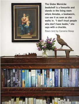 ??  ?? The Globe Wernicke bookshelf is a favourite and stands in the living room where Anneke, a bookworm, can see it as soon as she walks in. “I don’t trust people who don’t have books,” she says with a chuckle.
Resin bird by Cornelia Stoop