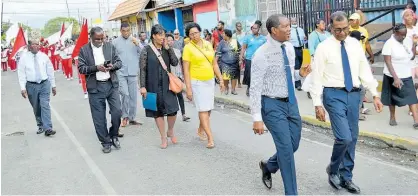  ?? RASBERT TURNER ?? Members of the church community walking through Spanish Town to the mass meeting on Sunday night.