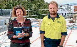  ??  ?? Marlboroug­h District Council quality systems manager Marianne Aitken, left, with T&D Constructi­on health and safety staffer Hadley Morgan on the new roof.