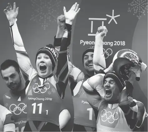  ?? DAN ISTITENE/GETTY IMAGES ?? Four years of team-relay luge frustratio­n came to an end at Olympic Sliding Centre in Pyeongchan­g, South Korea, Thursday as Team Canada Gough, second from left, Sam Edney, Justin Snith and Tristan Walker (not pictured) — captured a silver medal. Alex —