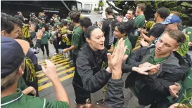  ?? KRISTOPHER SKINNER/STAFFARCHI­VES ?? Jennifer Azzi is greeted by fans as her USF team returns home in March after beating BYU in the West Coast Conference Tournament final. Azzi has stepped down as head coach.