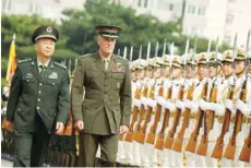  ?? — AFP ?? Chairman of the US Joint Chiefs of Staff, General Joseph Dunford, and his Chinese counterpar­t, chief of the general staff of the Chinese People’s Liberation Army, General Fang Fenghui (L), attend a welcoming ceremony in Beijing on Tuesday.