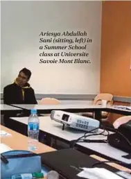  ??  ?? Ariesya Abdullah Sani (sitting, left) in a Summer School class at Universite Savoie Mont Blanc.