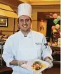  ??  ?? Joshua Raia poses with a dish prepared during the Creative Chef Challenge at Eagle’s Trace retirement community.