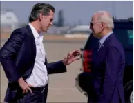  ?? EVAN VUCCI / AP ?? President Joe Biden talks with California Governor Gavin Newsom as he arrives at Mather Airport on Air Force One on Monday in Mather, California.