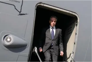  ?? AFP PHOTO ?? TREAD CAREFULLY
United States Secretary of State Antony Blinken disembarks from his plane upon his arrival at Egypt’s capital Cairo on Tuesday, Feb. 6, 2024.