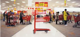  ?? Ian Willms / New York Times ?? An empty shopping cart sits in a Target store in Toronto, days before the retail chain closed all 133 locations in Canada last month.