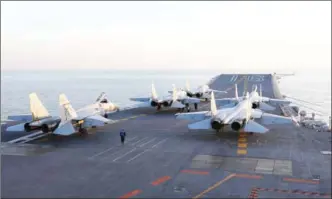  ?? STR/AFP ?? Chinese J-15 fighter jets are parked on the deck of the Liaoning aircraft carrier during military drills in the Bohai Sea off China’s northeast coast this month.