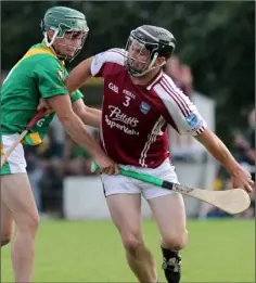  ??  ?? John Coleman of St. Martin’s is challenged by Paudie Kinsella.