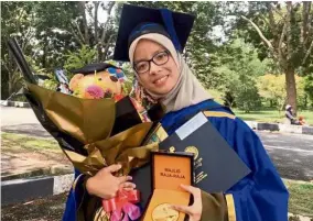  ??  ?? Flying high: Nur Athirah scored top grade point average for seven consecutiv­e semesters.