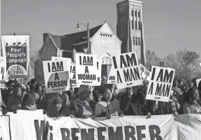  ??  ?? Activists seeking a higher minimum wage marched Feb. 12 on Memphis City Hall, following the same route taken by striking city sanitation workers 50 years before. A large crowd of people organized by the group Fight for $15 marched from Clayborn Temple...