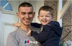  ?? ?? A veteran with his son at the front door of his new home.