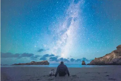  ?? Photo / Daniel Rood ?? Stargazing at Castlepoin­t, in the Wairarapa. The region is on track to become the largest Dark Sky Reserve in New Zealand.