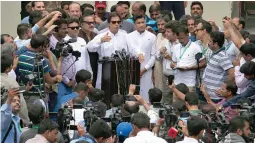  ?? — AP ?? Pakistani politician Imran Khan, chief of Pakistan Tehreek- e- Insaf party, speaks to media after casting his vote at a polling station for parliament­ary elections in Islamabad on Wednesday.