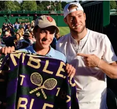  ??  ?? Meeting his hero: Peter, 14, with Jack Sock on Friday