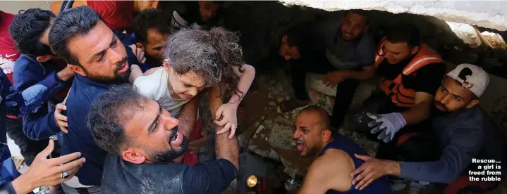  ?? Pictures: GETTY ?? Rescue... a girl is freed from the rubble