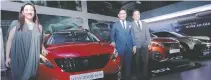  ??  ?? PEUGEOT PHILIPPINE­S officers (from left) Karen S. Carvajal, marketing director, and Glen P. Dasig, president, with Ronnie Mercado, ASEAN sales manager of PSA Group.