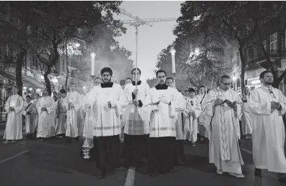  ?? Sean Gallup / Getty Images ?? An evening, candle-lit procession of the faithful walk towards the venue of Sunday’s open-air Mass with Pope Francis in Budapest, Hungary. Francis’ tour to Slovakia and Hungary could present some awkward political moments.