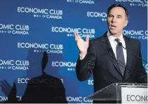  ?? JEFF MCINTOSH THE CANADIAN PRESS ?? Finance Minister Bill Morneau says the TMX expansion is going ahead, but pledges $500M a year for clean energy projects.