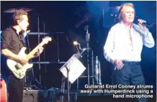  ??  ?? Guitarist Errol Cooney strums away with Humperdinc­k using a
hand microphone