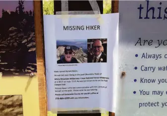  ?? Courtesy Mark McConnell ?? While preparing to search for missing friend Ron Bolen on July 15, Mark McConnell taped a missing-person poster to the Boundary Peak trailhead sign in Nevada.