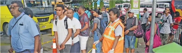  ?? Photo: Ronald Kumar ?? Suva City Council enforcemen­t officer, Lusiana Cagilaba, monitors movement of people at the Suva Bus Stand on April 21, 2020.