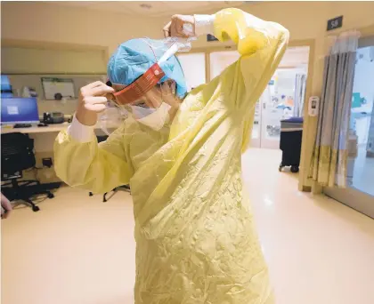  ?? STEVEN SENNE/AP ?? A nurse prepares to enter a patient’s room Jan. 3 in the COVID-19 Intensive Care Unit at Dartmouth-Hitchcock Medical Center, in Lebanon, New Hampshire.