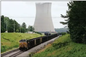  ?? AP file photo ?? A coal train sits at the White Bluff power plant near Redfield in Jefferson County in 2014. The White Bluff plant emitted 46.2 million pounds of sulfur dioxide, 22.8 million pounds of nitrogen oxide and 18.3 billion pounds of carbon dioxide in 2017, according to Entergy’s air pollutant report to the U.S. Environmen­tal Protection Agency.