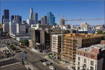  ?? Robert Gauthier Los Angeles Times ?? CITY ATTY. Mike Feuer says that getting people off the street is the priority, but that until there is enough housing, there should be limits on where people can sleep. Above, supportive housing being built in L.A.