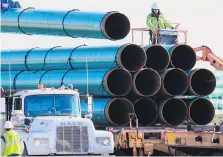  ?? NATI HARNIK/THE ASSOCIATED PRESS FILES ?? The contentiou­s Dakota Access pipeline has drasticall­y shrunk shipping costs for companies in the Bakken oilfield, making them more competitiv­e with their rivals.