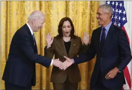  ?? CAROLYN KASTER — THE ASSOCIATED PRESS ?? Vice President Kamala Harris reacts as President Joe Biden shakes hands with former President Barack Obama after Obama jokingly called Biden vice president at the White House in Washington on Tuesday.