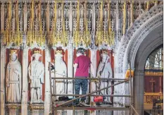  ?? PICTURES: JAMES HARDISTY. ?? FINISHING TOUCHES: Lee Godfrey, mason conservato­r at York Minster, works on the Pulpitum, which features 15 stone statues of medieval monarchs, as the project to refurbish its Grand Organ enters its final phase.