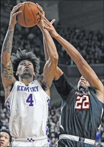  ?? Brad Tollefson The Associated Press ?? Kentucky forward Nick Richards grabs a rebound against Texas Tech forward T.J. Holyfield in overtime of the Wildcats’ 76-74 win Saturday at United Supermarke­ts Arena.