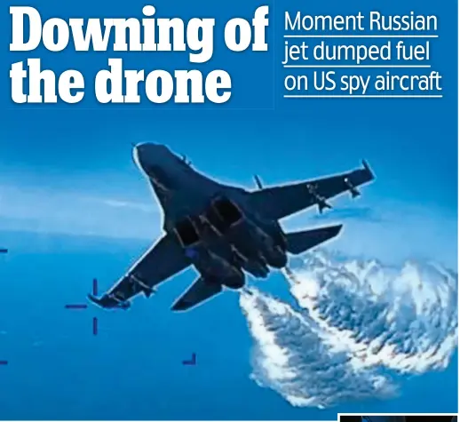  ?? ?? Fuelling tensions: The Russian SU-27 drops aviation fuel on the US Reaper drone