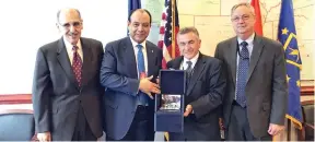  ??  ?? GACA President Abdulhakim bin Mohammed Al-Tamimi, second left, exchanges a memento with Ali Bahrami, associate administra­tor for aviation safety, second right, at the US Federal Aviation Administra­tion in Washington on Monday.