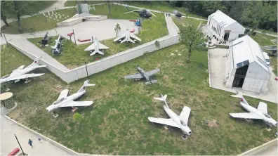  ?? Pictures: AFP ?? FLY-PAST. Russian and Chinese-made military planes parked in the front yard of the Albanian army museum in Berzhite, near the capital Tirana.