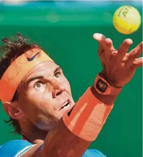  ?? AFP PIC ?? Rafael Nadal serves against Roberto Bautista Agut during their match in Monte Carlo on Wednesday.